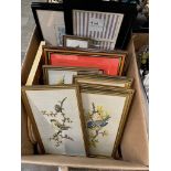 A box of picture frames and various embroidered pictures