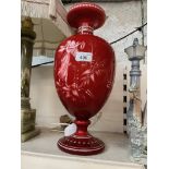 A Victorian red overlay on white glass vase, etched with intaglio decoration. Ht. 40cm