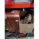 A box of treen to include wooden stands, candlestick holders, bellows and a leather luggage carrier.