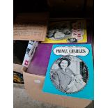 A box of royal ephemera and scrapbooks dating from the death of the king to the modern day.