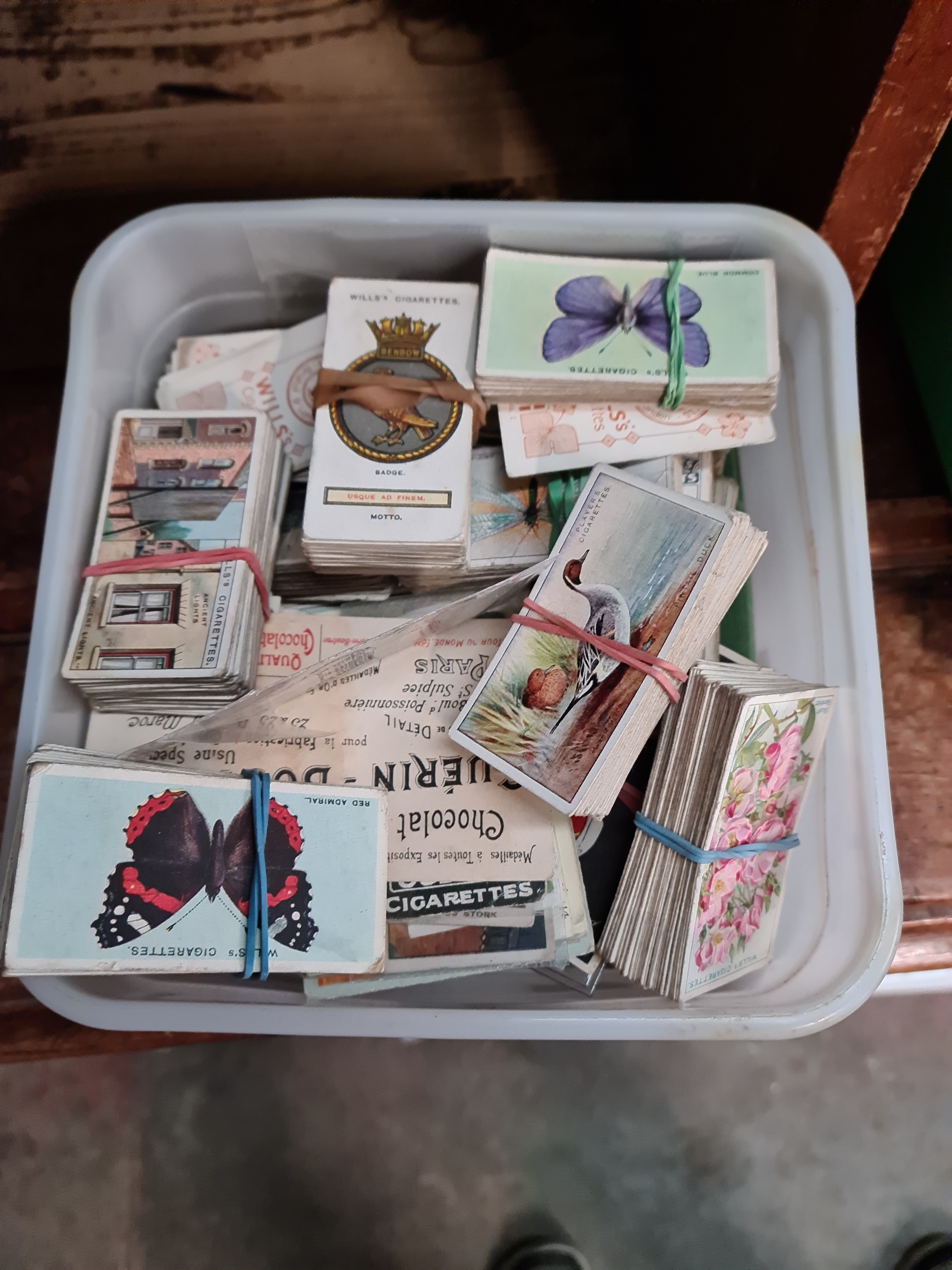 A box of cigarette and picture cards.