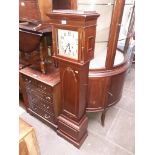 A mahogany cased chiming granddaughter clock.