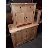 A light oak sideboard and a light oak side cabinet.