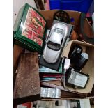 A box of misc including books, PIR light, tea lights, Dominoes and cribbage board, haberdashery