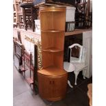 A mid 20th century teak corner unit.