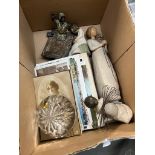 A box of collectables including tea cards, vintage postcards, a vintage metal Egyptian figure, three