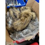 A box of faux fur wraps by Top Shop