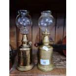 Two vintage French brass carriage lamps with glass shades.