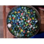 A sweet tin of marbles.