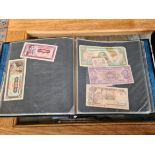A collection of world banknotes.