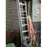 A set of aluminium extending ladders.