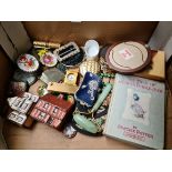 A box containing various collectables including compacts, trinkets etc.