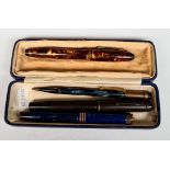 A group of four vintage pens/pencils including two with 14K nibs.