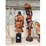 Two African carved wood figures.