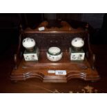 Edwardian oak desk stand with ceramic inkwells.