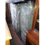 Five glass display cabinets.