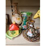 Four pieces of pottery including Doulton twin handled bulbous vase and Carlton ware pieces and two