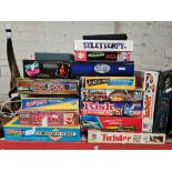 A collection of board games including Risk, Operation, Twister, Monopoly etc.