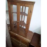 A Victorian pine chest of drawers and a glazed pine corner cabinet.