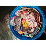 A tub of tin badges.