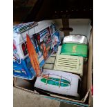 A box of novelty biscuit tins.