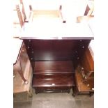 Various items of Stag mahogany furniture; a tallboy, a bedside cabinet, a bookcase, and a Stag TV