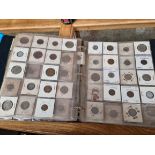 An album of assorted coins.