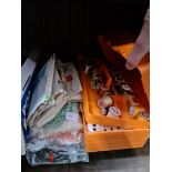 A cantilever box containing cotton bobbins, haberdashery, fasteners, buttons, dress patterns,
