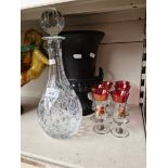 Black pottery vase, glass decanter and six small glasses