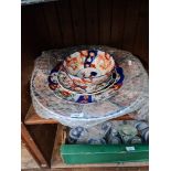 A collection of Chinese Imari style plates and a a similar bowl.