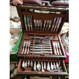 Twelve place setting of silver plated cutlery by Priestley and Moore Sheffield in an oak canteen