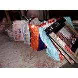 Four large bags of assorted haberdashery material, a box of wool, sewing bag, four pattern books.