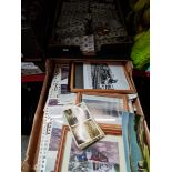 A box of vintage postcards & photographs