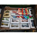A box of model vehicles including Burago and Exclusive first editions