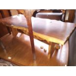 A rustic yew wood coffee table.