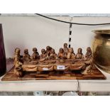 A 20th century olive wood carving depicting The Last Supper, length 50cm.