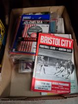 A box of football programmes.