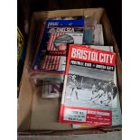 A box of football programmes.