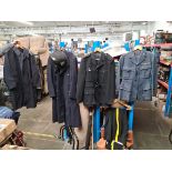 Various military and constabulary clothing items to include trench coat, hat, uniforms, etc.