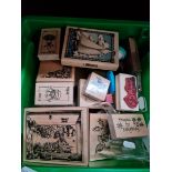 A box of wooden craft printing blocks.