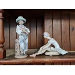 Two Lladro figures.