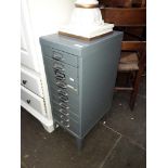 Grey metal filing drawers.