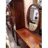 An Edwardian inlaid mahogany dressing table and double wardrobe.