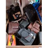 A box of assorted cameras including Zeiss Ikon, Kodak, Polaroid, Voigtlander etc.