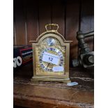 A brass carriage clock.