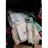 A bag of linen and lace including some antique pieces.