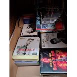A box of assorted Elvis memorabilia.