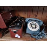 A field telephone and a 70s type house phone.