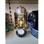 Two specemin stone globe clocks inlaid with semi precious stones.