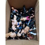 A box of assorted wrestling figures.